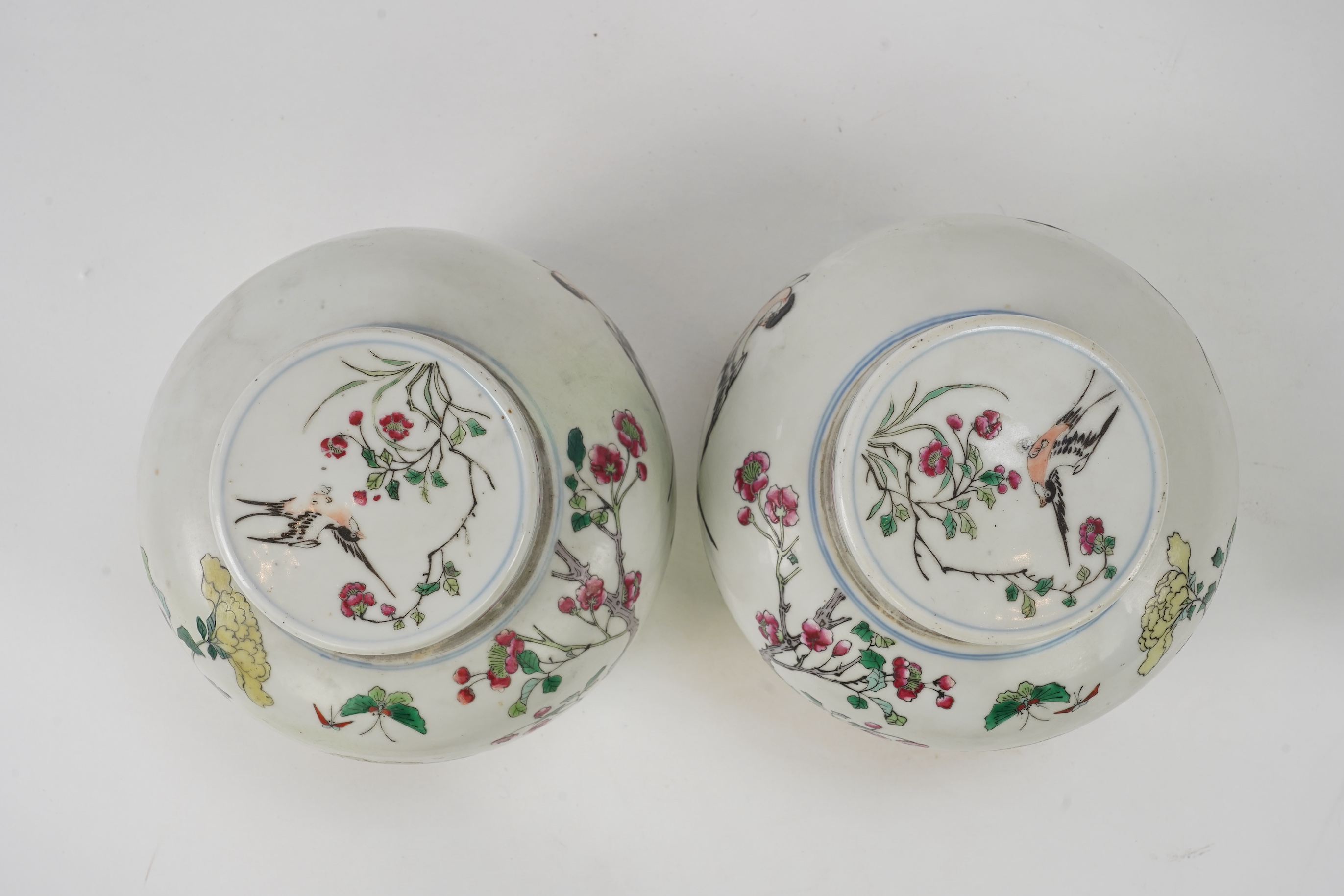A pair of Chinese famille rose jars and covers, Kangxi mark but late 19th/early 20th century